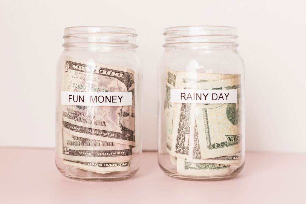 money in jars that say "fun money" and "rainy day". No spend challenge ideas